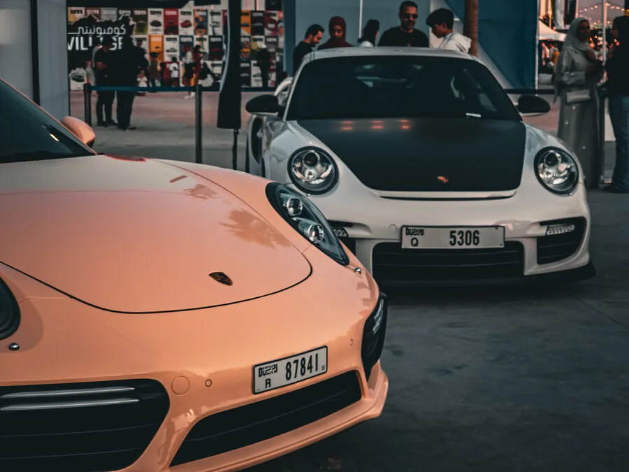 Rose gold and white Porsches